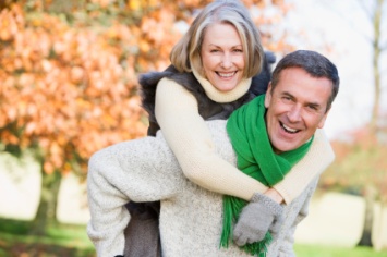 Man giving women a piggyback ride