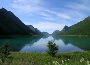 Water reflecting the mountains on both sides