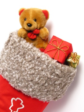 Teddy bear and gifts in a stocking