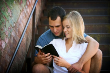 Man and women reading a bible